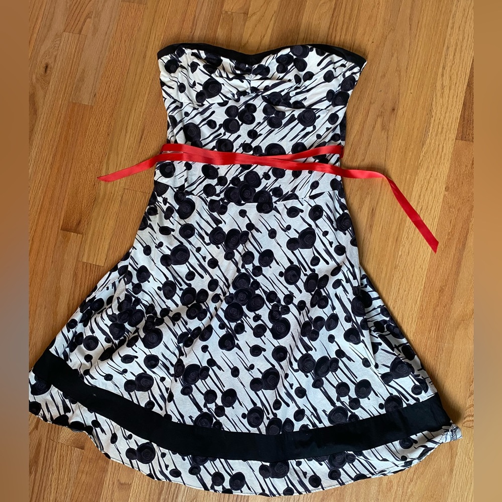 Black and white dress with red ribbon tie